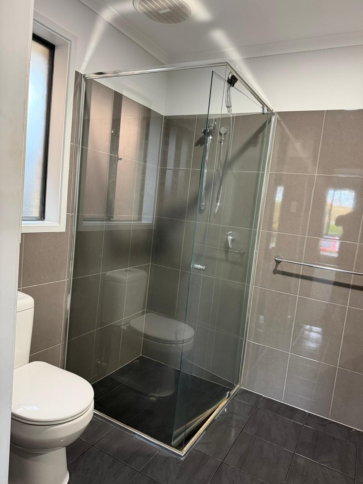 Cleaned bathroom showing shower screen and toilet - end of lease clean Adelaide