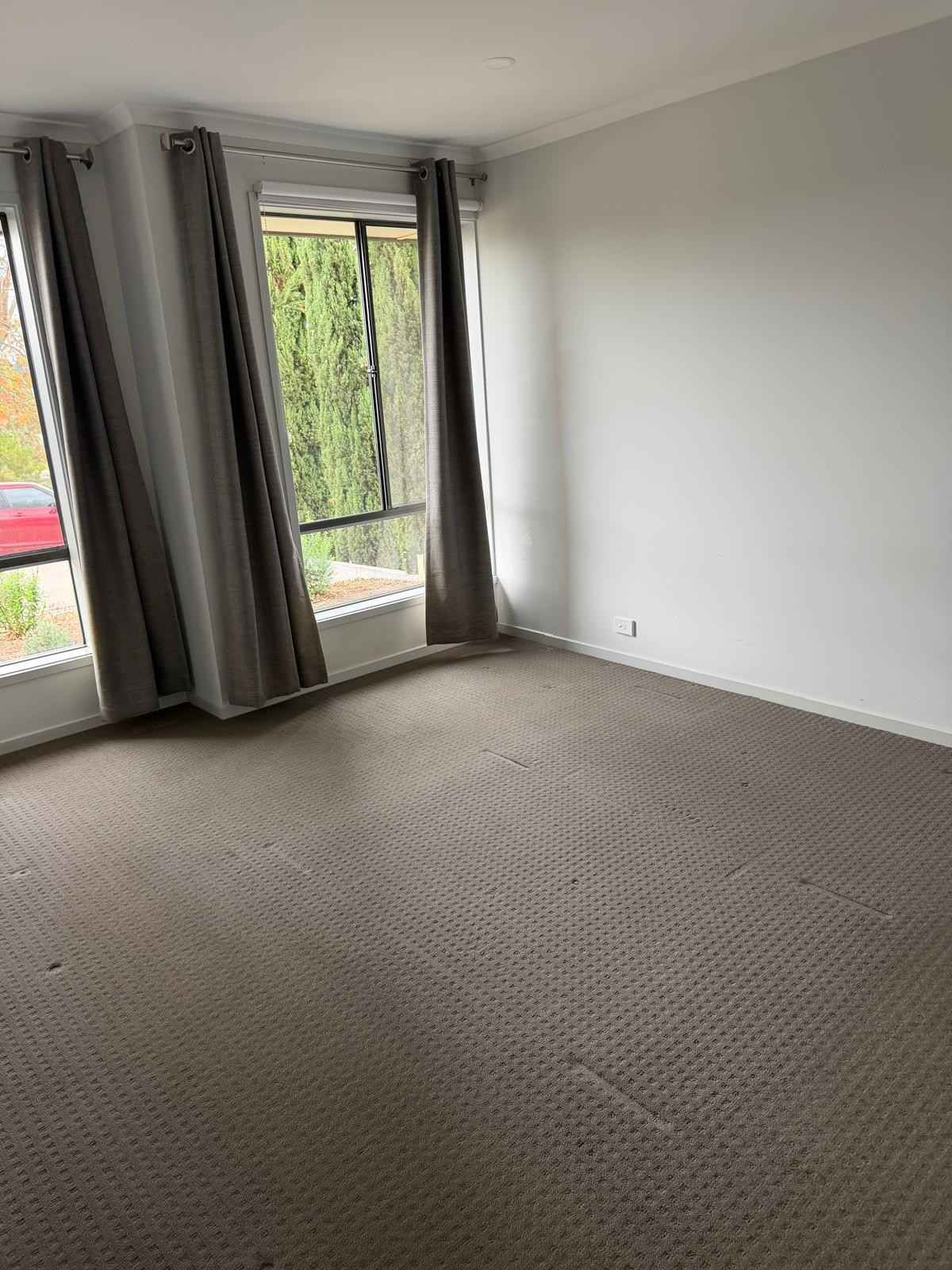 Clean bedroom with vacuumed carpet and curtains - end of lease clean Adelaide