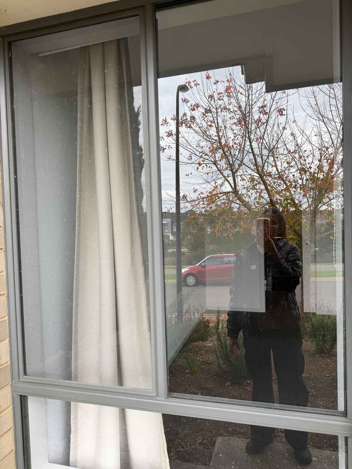 Scrubhubb team member cleaning windows - window cleaning Adelaide